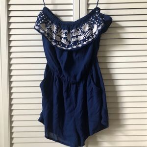 Navy blue romper with white embroidery